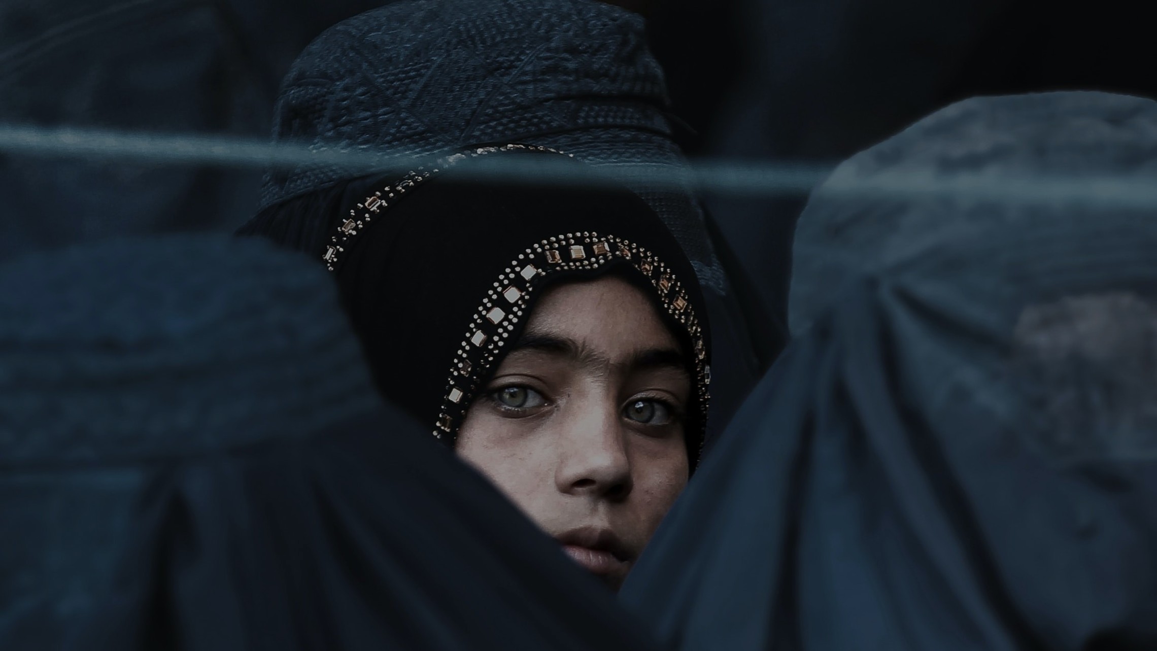 Afghan girl looks at camera